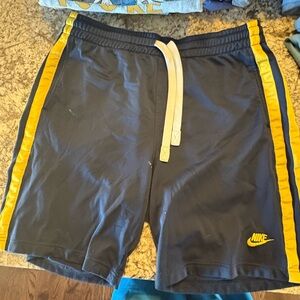 Nike Men's Athletic Shorts in Black with Yellow Stripes